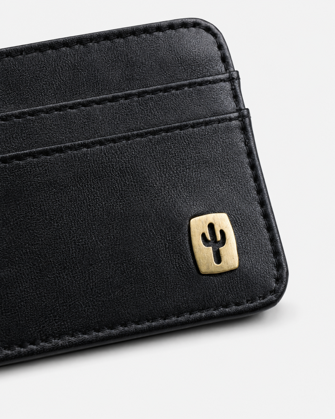 Vegan card holder in black made from cactus leather, in hand