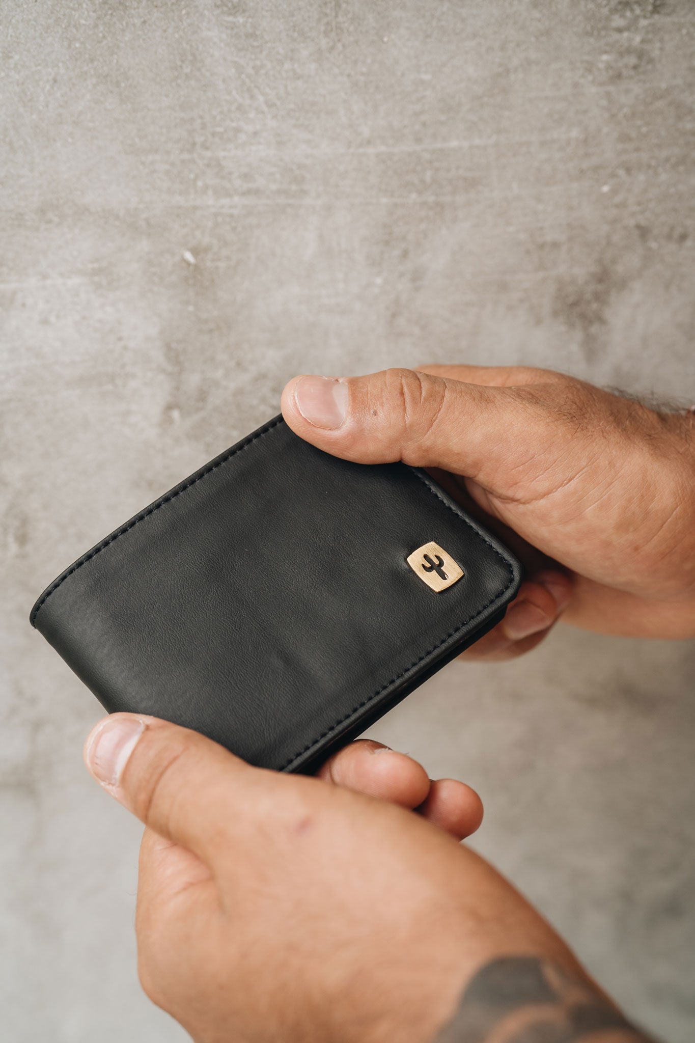 Man holding his Cactus Leather wallet